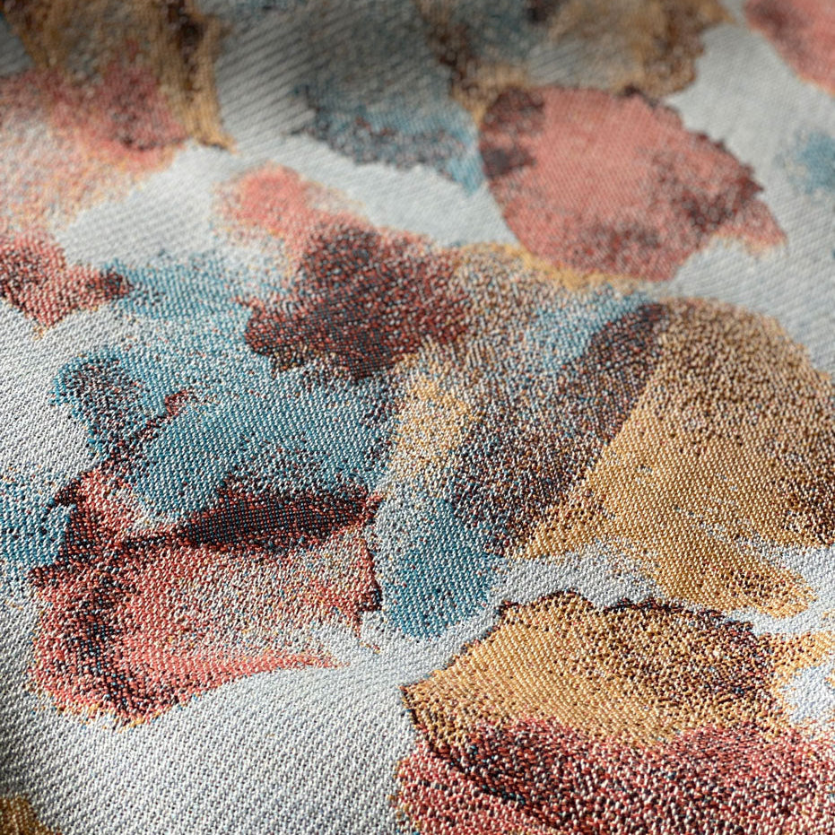 Close-up of a fabric with a floral pattern in multicolor shades, showcasing texture and detail.