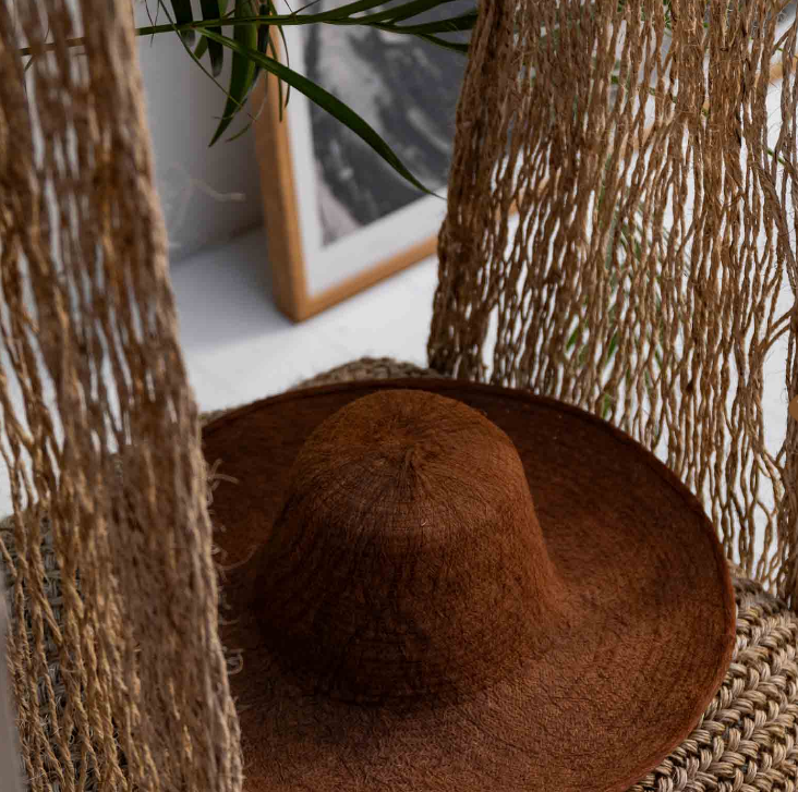 woven Albeira swing with cushion and bron hat 
