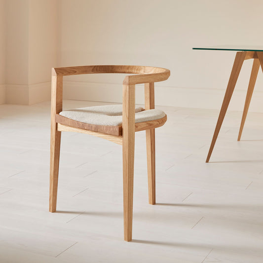 Compass upholstered dining chair in oak with a wool-upholstered seat