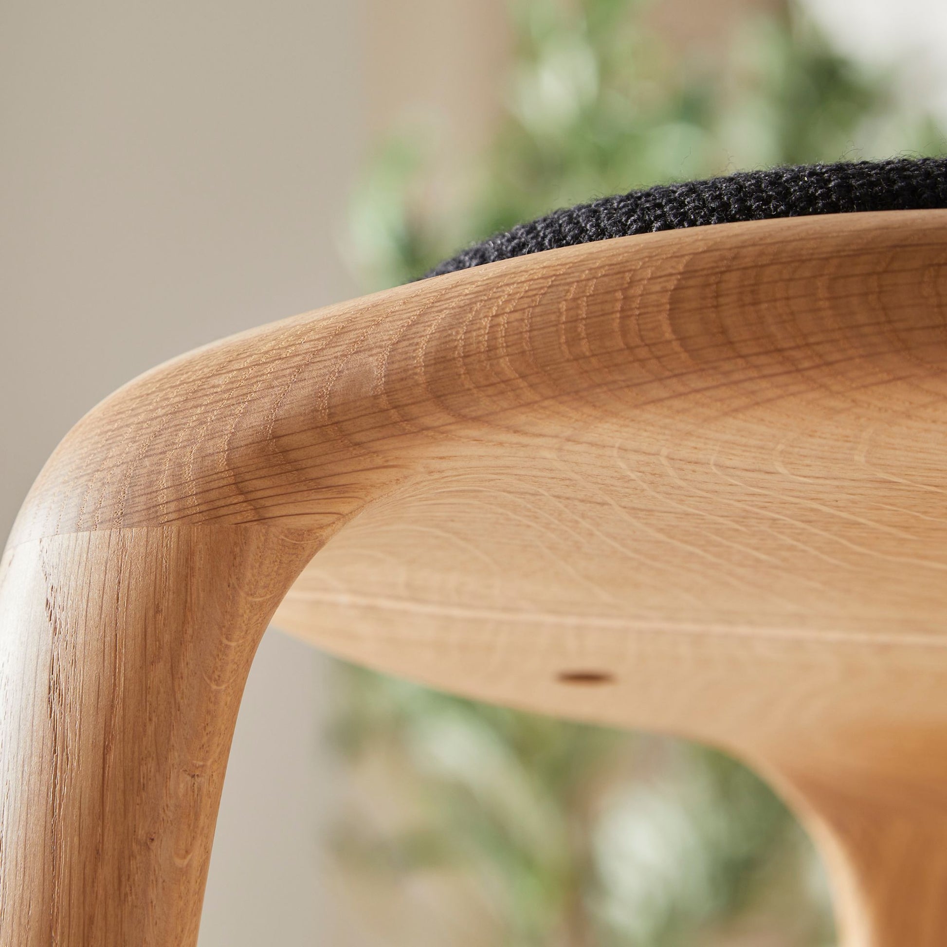 Flow upholstered oak stool, side view