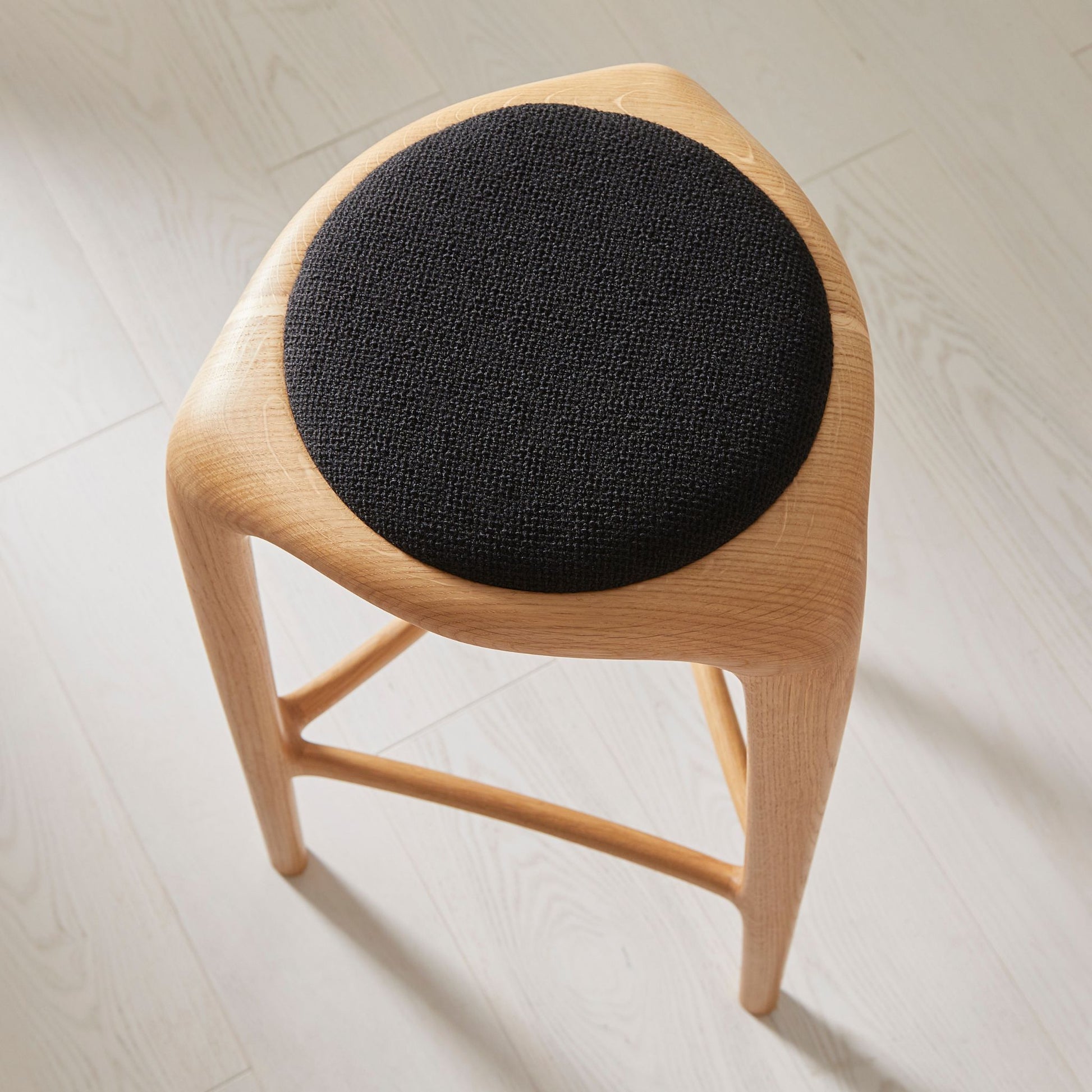Flow upholstered oak stool, seat detail