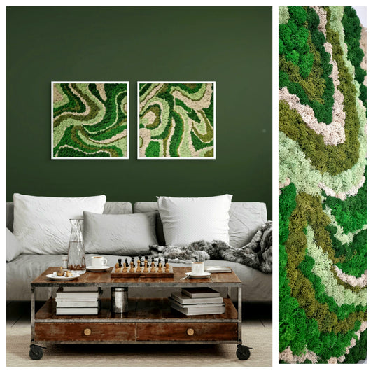 Two frames with vibrant reindeer moss arranged in a swirling pattern, displayed on a green wall above a grey sofa with white cushions. The artwork has a organic shape and a mesmerizing visual flow.