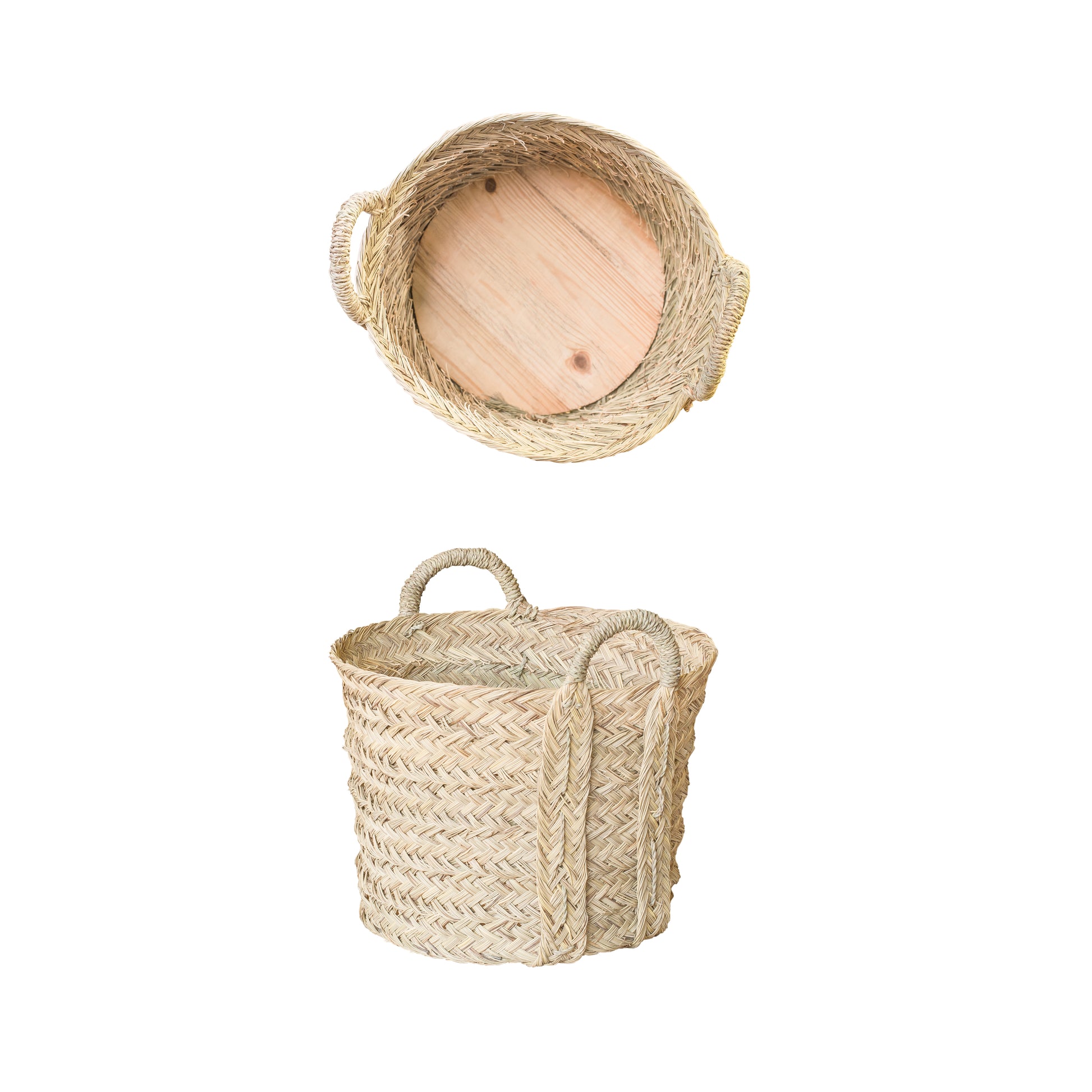 Woven basket in natural materials with wood bottom on a white background
